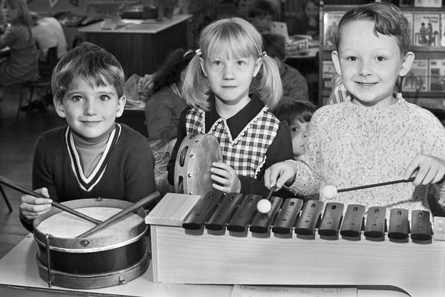 Musical trio Michael Walkden, Diane Clift and Merryck Lowe at Evans County Infants School, Ashton, in October 1976.