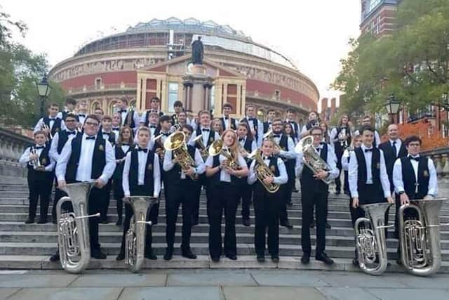 Wigan Youth Brass Band members outside the Royal Albert Hall at the Schools Prom several years ago