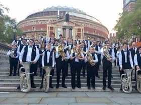 Wigan Youth Brass Band members outside the Royal Albert Hall at the Schools Prom several years ago