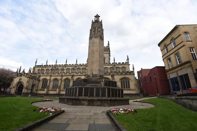 Wigan war memorial next to All Saints Wigan parish church - WW1 hero John Donnelly named.