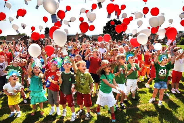 Pupils of Millbrook Primary School, Shevington, release balloons at the end of a Super Learning week culminating in them dressing up in the colours of the World Cup teams and a balloon race organised by the school and parents on Friday June 9th 2006. 