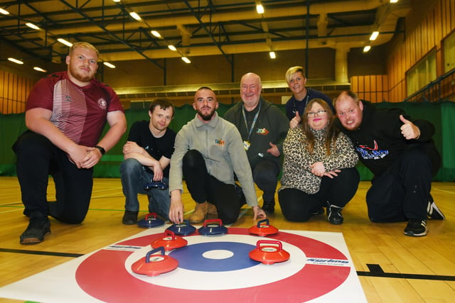 Members from Thrive CIC try curling