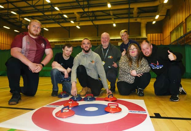 Members from Thrive CIC try curling