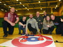 Members from Thrive CIC try curling