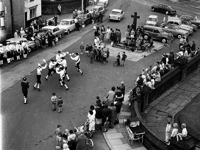 A great flashback photograph of village life in Standish during the summer of 1968. Taken from the tower of St Wildrid's Church this picture shows  Morris Men entertaining  a  group of locals.