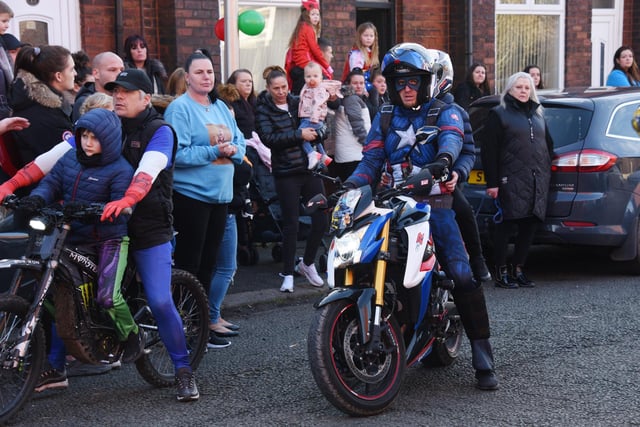 Theo Wood's love of motorbikes and superheroes was marked in the procession