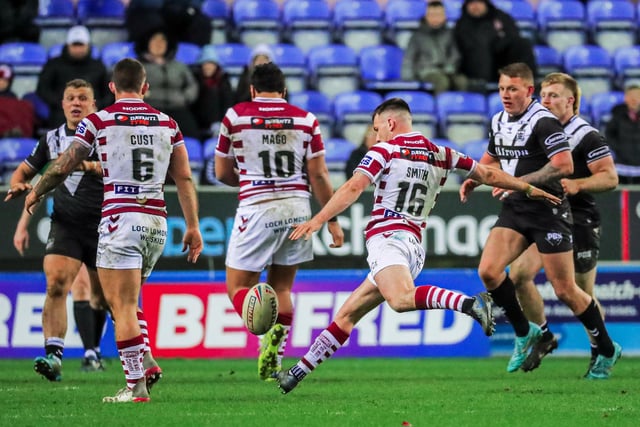 Harry Smith kicked a late winning drop-goal to give Wigan a 19-18 victory over Hull FC.