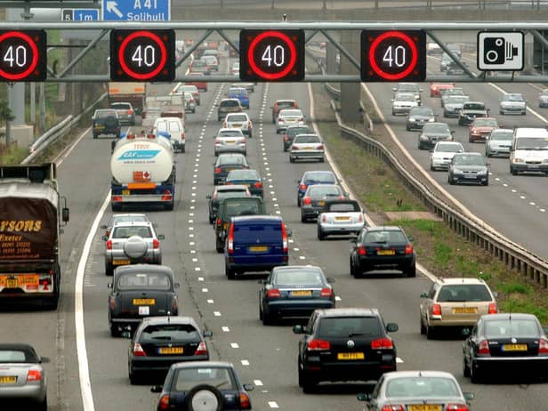 Motorists drive on the hard shoulder of one of the busiest stretches of motorway in Britain between junctions 3 and 7 of the M42