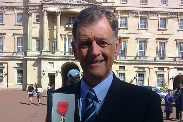 Mel receiving his MBE in 2014