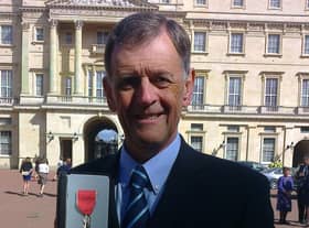 Mel receiving his MBE in 2014
