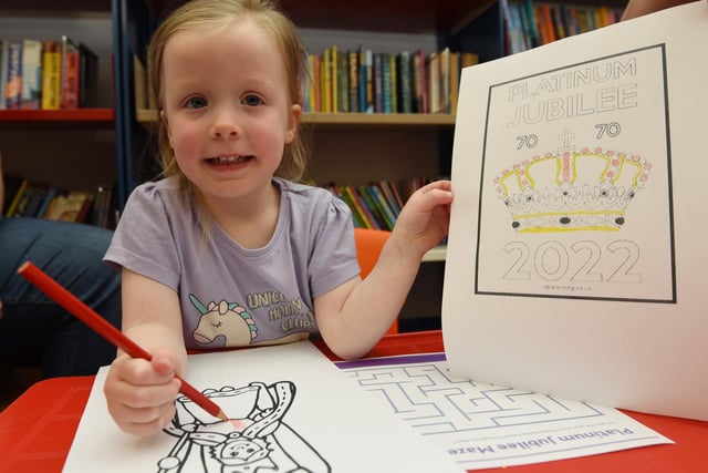 Myla, two, joining in with celebrations at Standish Library, as they host a garden party to celebrate the Queen's platinum jubilee.