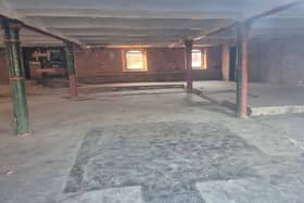 Photo taken through the window of the '90% completed redevelopment of Wigan Pier'. How many years to get to this??