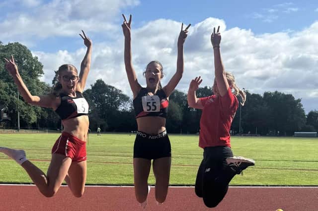 Members of the Wigan Harriers team celebrate their success