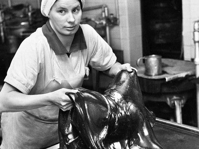 Elizabeth Burns mixing a slab of Uncle Joe's Mint Balls at the Santus factory in Dorning Street, Wigan, in July 1977.
