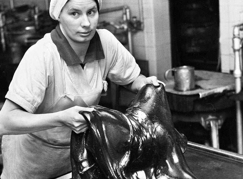 Elizabeth Burns mixing a slab of Uncle Joe's Mint Balls at the Santus factory in Dorning Street, Wigan, in July 1977.