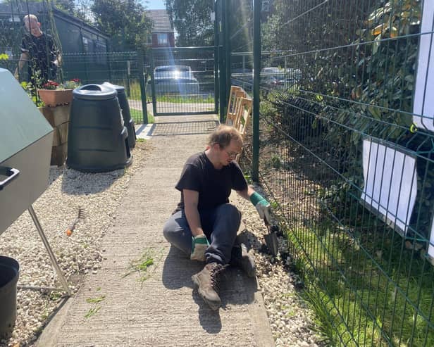 Members of the community working on the allotment