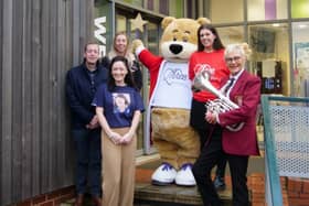 Elle Smith (in purple) alongside her family and members of the Three Wishes charity