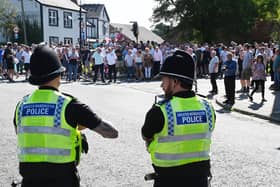 Members of the community gathered in Market Place, Standish to take part in a protest against plans to accommodate asylum seekers at Kilhey Court