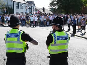 Members of the community gathered in Market Place, Standish to take part in a protest against plans to accommodate asylum seekers at Kilhey Court