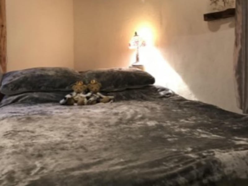 The master bedroom has a comfortable kingsize bed.