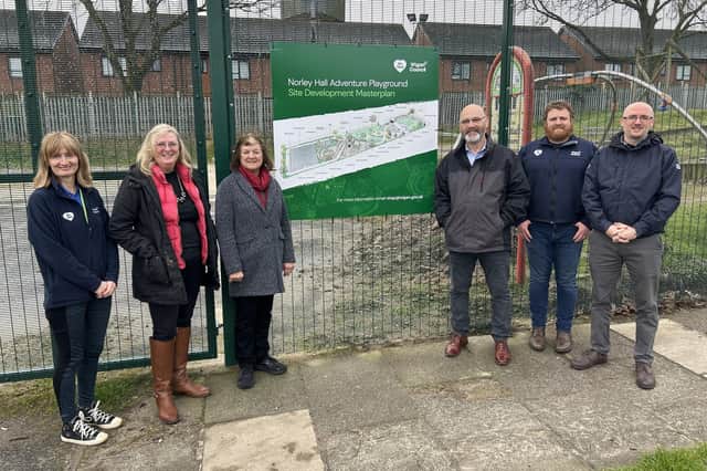 Wigan Council cabinet members Coun Jenny Bullen, Coun Paul Prescott and Coun Susan Gambles with members of the Be Well play team at Norley Hall Adventure Playground