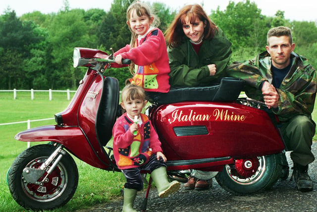 A family day out during a scooter rally at the Douglas Valley ground of Wigan Rugby Union Club on Saturday 8th of May 1999.