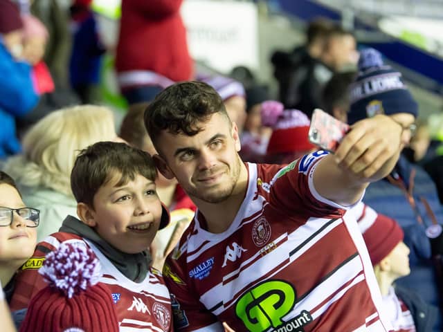 Tom Forber with fans and supporters following the win over Huddersfield