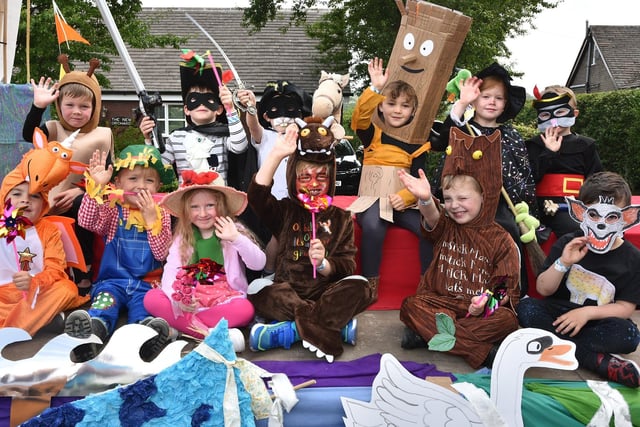 Reception class pupils dress in Julia Donaldson characters in the Newburgh Fair procession.