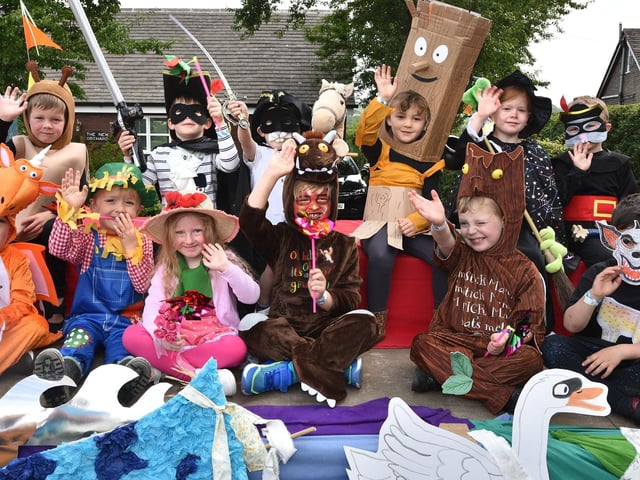Reception class pupils dress in Julia Donaldson characters in the Newburgh Fair procession.