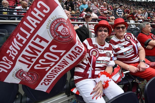 Fans dressed head to toe in cherry and white.