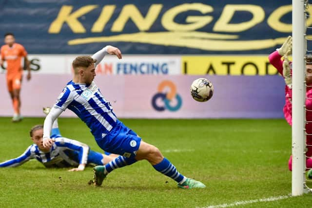 Scott Smith slides in the only goal at the DW to lift Latics to 50 points for the campaign