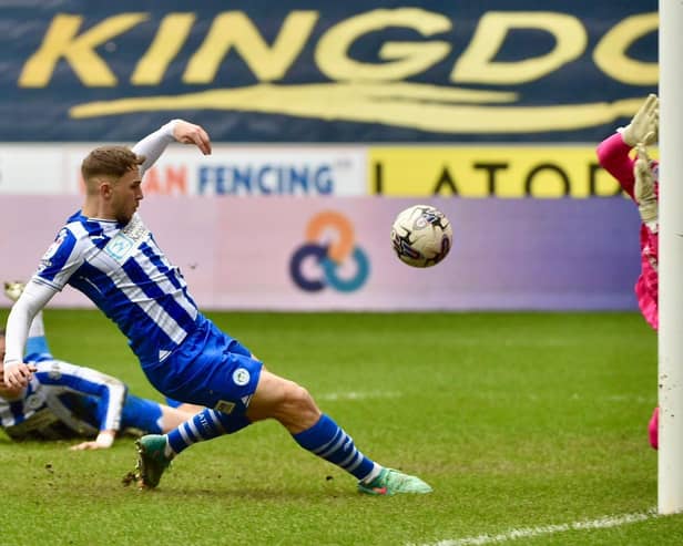 Scott Smith slides in the only goal at the DW to lift Latics to 50 points for the campaign