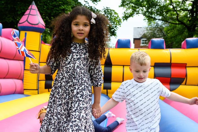 Isla-Ray Lucas and Jesse-James Curtis having fun on a bouncy castle Crowds enjoying the entertainment on offer at the Mayor's Jubilee Gala in Pennington Hall Park, Leigh. Photo: Kelvin Stuttard