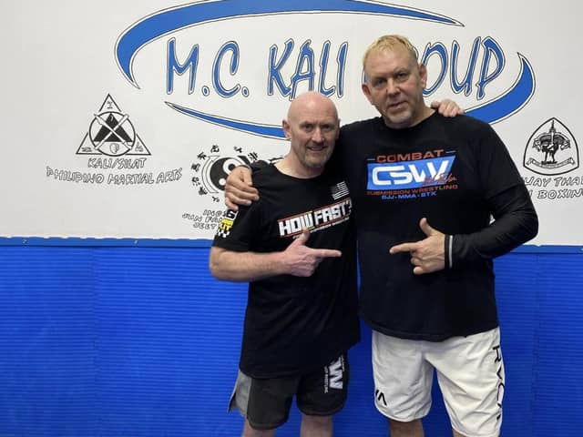MC Kali Group's Mel Corrigan with MMA coach Erik Paulson