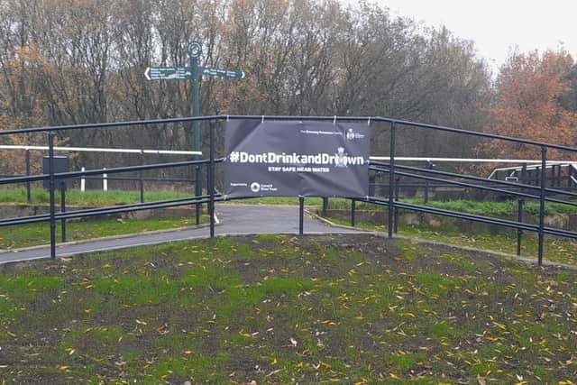 The Canal and River Trust's special Don't Drink and Drown banner placed near one of Wigan's canal towpaths