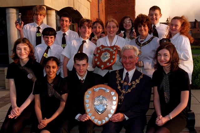 The Deputy Mayor and Mayoress, Coun and Mrs. Ken Pye, present Young Enterprise Awards to overall Hawkley Hall High School and runners-up Hesketh Fletcher High