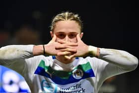 Thelo Aasgaard in familiar pose in front of the away end at Mansfield