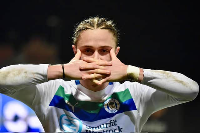 Thelo Aasgaard in familiar pose in front of the away end at Mansfield
