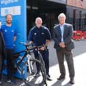 Welcoming the Tour of Britain to Wigan are councillors Chris Ready, left and David Molyneux, right, with Richard Smith and Andrew Hakesley, from Be Well