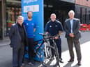 Welcoming the Tour of Britain to Wigan are councillors Chris Ready, left and David Molyneux, right, with Richard Smith and Andrew Hakesley, from Be Well