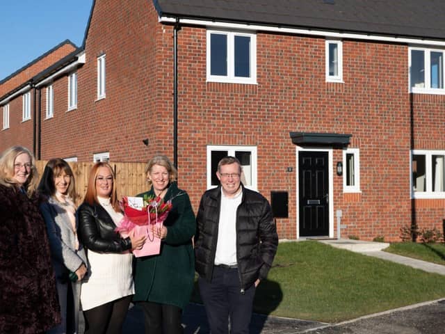 Resident Katie is welcomed to her new home by Coun Gambles, Hilary Roberts and Peter Barlow