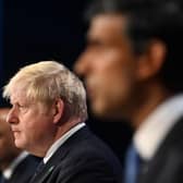 Boris Johnson flanked by Sajid Javid and Rishi Sunak who have both resigned from the cabinet