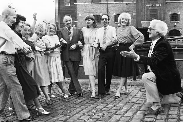 Wigan dance teacher and former world champion,Tom Moss, rehearsing his newly created dance "The Wigan Stroll" at Wigan Pier on Monday 25th of November 1985.
The dance was set to music by the Houghton Weavers folk group.
