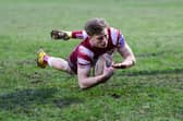 Logan Astley of Wigan Warriors scores against Whitehaven at Recreation Ground Stadium during 2023 pre-season