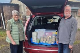 Alison and Stephen Knowles, from Canine Companions (Wigan) Ltd, take donated dog food to Makants Greyhound Rescue in Tyldesley