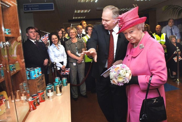 The Queen is shown some of the Heinz products by Scott O'Hara, Executive Vice President, President and Chief Executive Officer, Heinz Europe, during her tour.