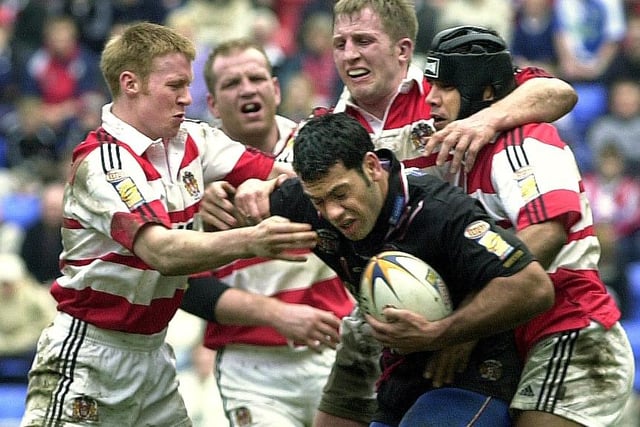 David Hodgson, Denis Betts and Steve Renouf combine to stop former team-mate Kevin Iro during Wigan Warriors Good Friday Super League clash against St. Helens at the JJB Stadium on 13th of April 2001. The match was a 22-22 draw.