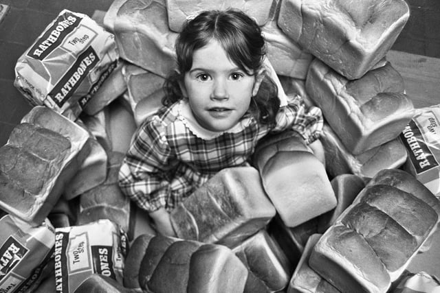In amongst the loaves is Katy Rathbone, aged 4, daughter of production director Roger Rathbone.
