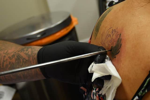 Skin Graffiti Tattoo Studio, Wigan, hosts Ajarn Ohr, a Sak Yant Master from Thailand, using traditional methods to create tattoos and blesses them.
