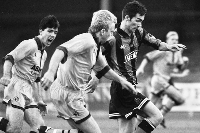 Wigan Athletic winger, Keith Gillespie, on loan from Manchester United, shows his pace against Mansfield Town in a Division 3 match at Springfield Park on Saturday 30th of October 1993.
Latics won 4-1 with 2 goals from Pat Gavin and one each from Keith Gillespie and Neil Morton.